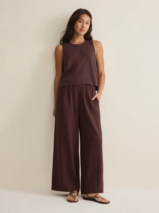 a soft pair of chocolate brown linen pants with pockets paired with a matching top