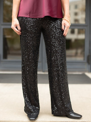 wear this pair of black sequined pants for a glamorous vibe at holiday parties and christmas events