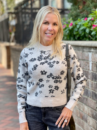 a pale gray sweater with black flower pattern and a mock turtleneck perfect for feminine fall and winter fashion