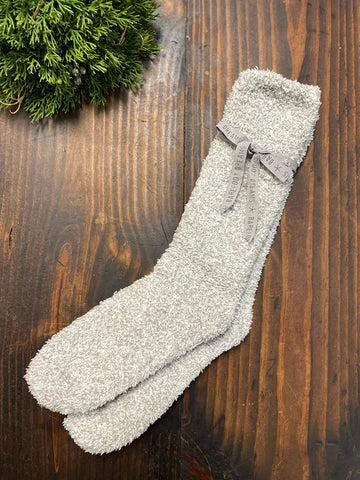 neutral heathered oyster and white blend comfort socks tied together with a ribbon
