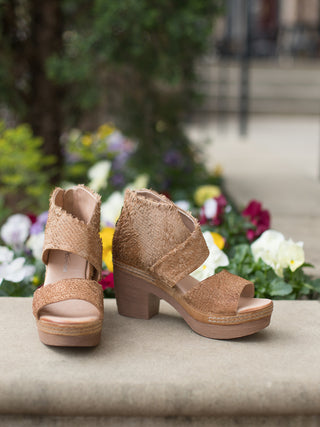 supremely comfortable tan high ankle heeled sandal with textured leather straps in asymmetrical design side view