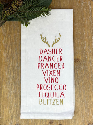 a witty white and red christmas tea towel listing reindeers and types of liquor perfect as a holiday present and host gift