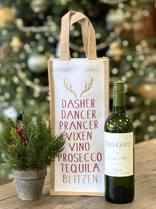 a witty christmas wine bag in natural materials that lists reindeer and types of alcohol great as a funny holiday host gift 