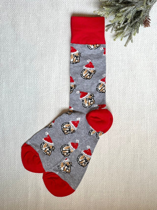 a pair of gray and red christmas socks that feature uga bulldogs with santa hat perfect as a holiday gift for dawgs fans