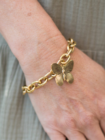 large gold monarch butterfly on gold chain bracelet made of antique gold plated over brass
