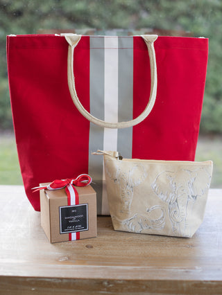 a red gray and white oversized tote bag with rope carrying straps shown with university of alabama candle and cosmetic bag