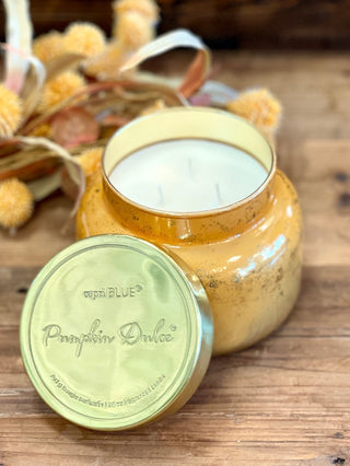a pumpkin dolce scented candle in orange mercury perfect for halloween and thanksgiving fall decor gifts