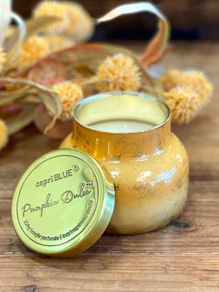 a pumpkin dolce scented candle in orange mercury perfect for halloween and thanksgiving fall decor gifts