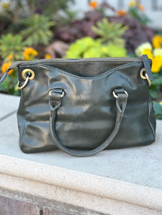Casual Friday Bag - Olive Adjustable crossbody strap included Exterior handles Zipper closure Two open exterior pockets suede trim Two open interior pockets One zipper interior pocket Bronze hardware Joy Susan L8093-03