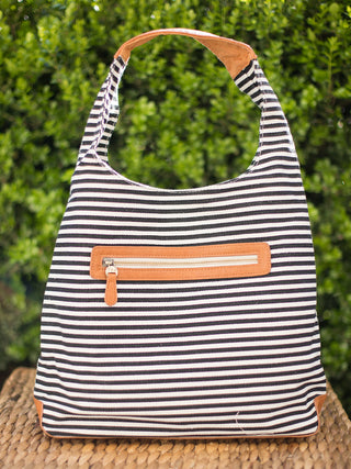 black and white striped canvas hobo handbag with zip pocket and and removable inner bag