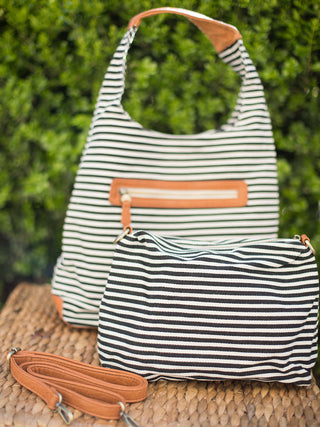 black and white striped canvas hobo handbag with zip pocket and and removable inner bag with crossbody strap