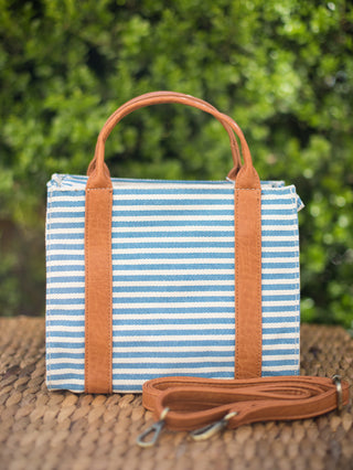 handbag with top handles blue and white stripes and removable crossbody strap trimmed with vegan leather