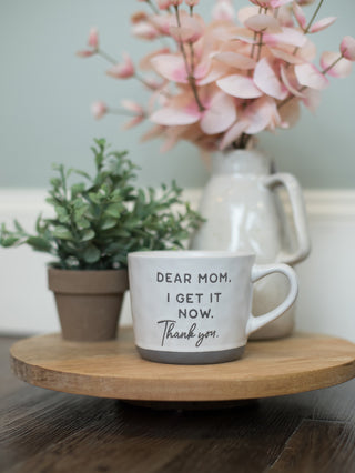 a white coffee mug with gray painted bottom that reads dear mom i get it now thank you