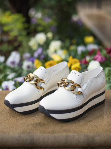 slip on platform sneakers white with black stripe with gold chain link buckle and made of soft suede and leather