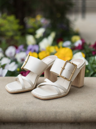 city ivory white slip on wood block heel sandals made of vegan leather with oversized gold buckles wide straps and square toe