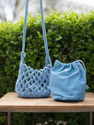 boho chic hand woven macrame open knit small blue crossbody bag with drawstring closure and removable inner bag