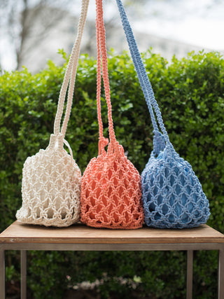 boho chic hand woven macrame open knit small crossbody bags in coral orange blue and ivory white