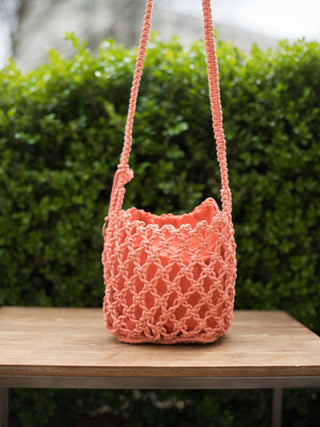 boho chic hand woven macrame open knit small crossbody coral orange bag with drawstring closure