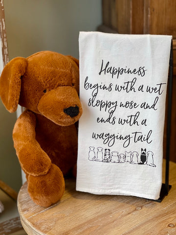 stuffed animal puppy dog dachshund holding kitchen towel with happiness sentiment