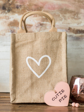 buy this natural canva gift tote made with sustainable material and a white heart on the front for every gift giving occasion