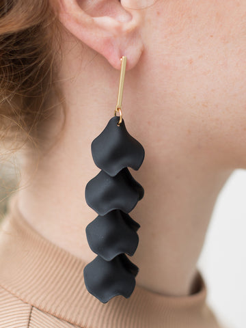 long dangle earrings with black cascading petals that drop from gold bar post are flirty and elegant for wedding game day