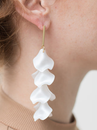 long dangle earrings with white cascading petals that drop from gold bar post are flirty and elegant for wedding
