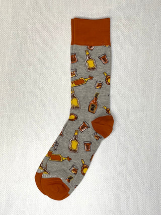 a pair of grey socks with orange trim and cocktail patterns great for father husband and boyfriend gifts 