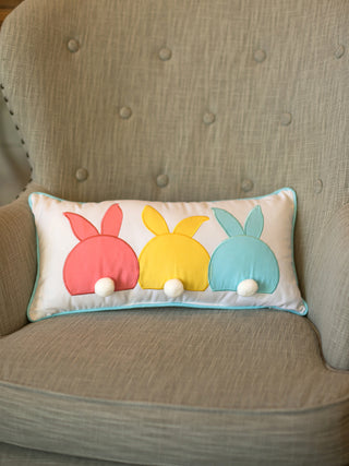 colorful easter applique decorative throw pillow with three bunny bums with pom tails