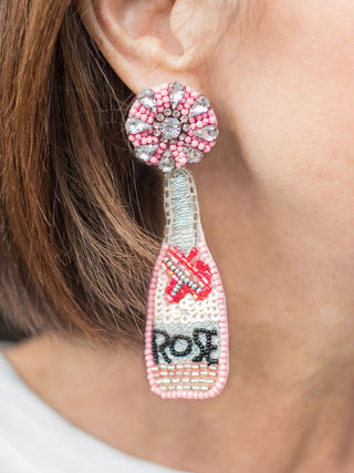 wine bottle earrings with multi colored glass beaded detailing anchored by pink and rhinestone studs that reads rose