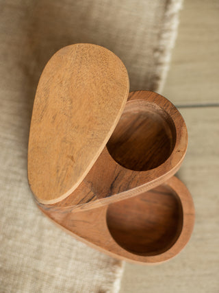 a salt and pepper wooden storage dish with a two tier design that swivels apart and a sliding lid