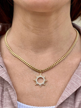 medium-sized gold curb chain necklace with striking rhinestone sun starburst pendant