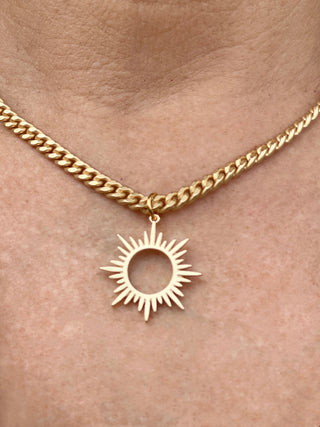 medium-sized gold curb chain necklace with striking rhinestone sun starburst pendant reversible side