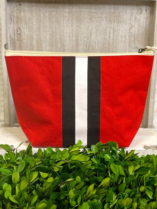 a red white and black cosmetic bag with a zipper closure perfect for uga fans and alumni