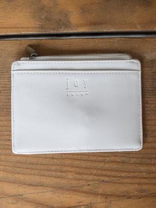 white vegan leather wallet with cardholder exterior card pockets and zipper closure back