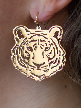 a pair of gold dangle earrings with a tiger face for tiger pride