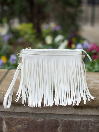 western style white vegan leather clutch purse handbag with fringe and comes with crossbody adjustable strap